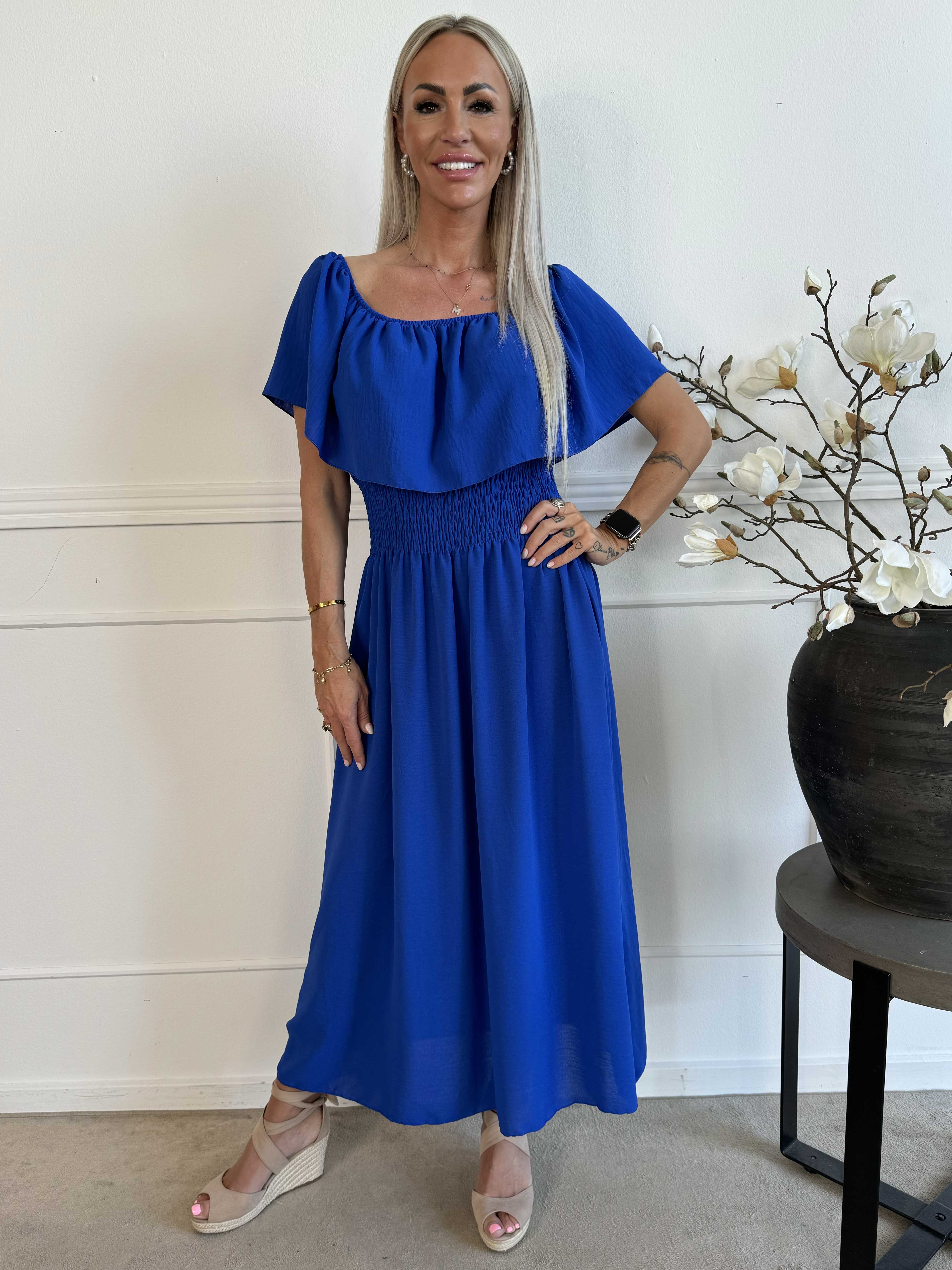 Rachel - Lång klänning med fickor och volang i nederkanten